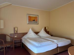 Postel nebo postele na pokoji v ubytování Haus Berrenrath