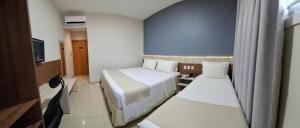 Postel nebo postele na pokoji v ubytování Hotel Gamboa Premium Macau