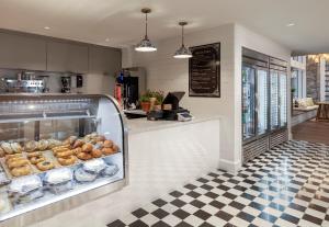 a bakery with a display case filled with donuts at Newport Harbor Island Resort in Newport