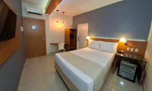 Postel nebo postele na pokoji v ubytování Hotel Gamboa Premium Macau