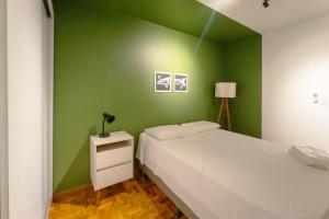 Postel nebo postele na pokoji v ubytování Apto Centro 3 QTS Ar Sensacional! MC51