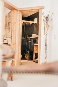 a view of a kitchen through a doorway at Chalet Sonnstein in Mieders +43 photos