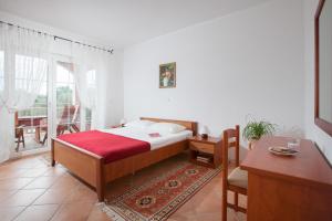 Ένα ή περισσότερα κρεβάτια σε δωμάτιο στο Villa Lidija