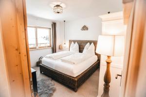 a bedroom with a bed and a lamp at Chalet Serles in Mieders
