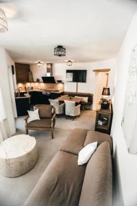 a living room with a couch and a table at Chalet Serles in Mieders