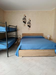 Ένα ή περισσότερα κρεβάτια σε δωμάτιο στο Casa Terry Galatina