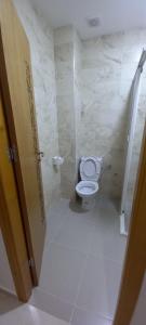a bathroom with a toilet and a glass shower at Yaacob & Adam apartment Riad Sofia Martil in Martil +16 photos