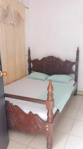 Ένα ή περισσότερα κρεβάτια σε δωμάτιο στο Casa Amarilla Hostel - Cali