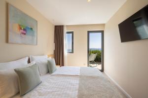 Postel nebo postele na pokoji v ubytování Holiday Home Poeta Brela