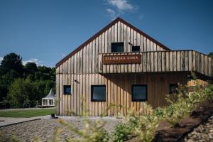a barn with a sign on the side of it at Štajerska sivka - Jacuzzi & Savna in Maribor +20 photos
