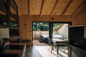 a kitchen and dining room of a house with a tub at Štajerska sivka - Jacuzzi & Savna in Maribor