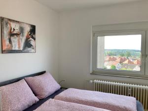 Ένα ή περισσότερα κρεβάτια σε δωμάτιο στο Dmon-Home