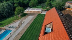 an overhead view of a house with an orange roof at Štajerska sivka - Jacuzzi & Savna in Maribor