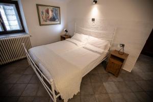 Postel nebo postele na pokoji v ubytování Il Borgo sul Lago di Como
