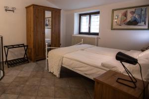 Postel nebo postele na pokoji v ubytování Il Borgo sul Lago di Como