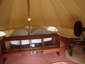 a room with a tent with two beds in it at Guajiru kite-safari Tendas in Itarema