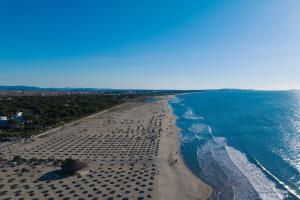an aerial view of a beach with people on it at Perla Penthouse - Happy Rentals in Mullini i Danit