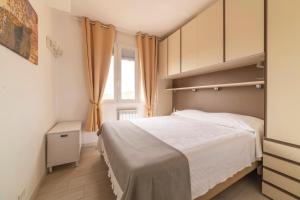 Postel nebo postele na pokoji v ubytování Attico Vista Mare