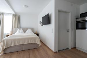 Postel nebo postele na pokoji v ubytování FarawayHomes Studio Fohnsdorf #A1