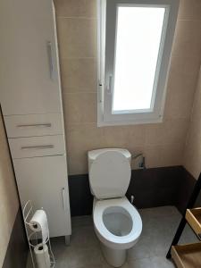 a small bathroom with a toilet and a window at La Marquesa Golf 3 bedroom Detached Villa in Ciudad Quesada +12 photos