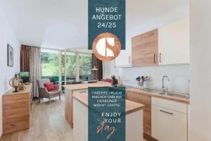 a kitchen with a sign that reads humble angelot at ALPINE Appartement 208 Schladming by globboard in Schladming