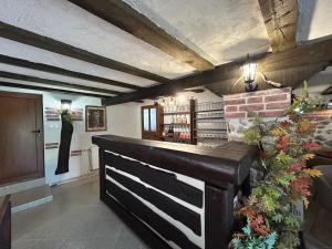 a bar in a room with a brick wall at Къща Цвети in Dobrinishte