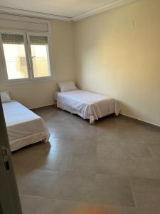 Postel nebo postele na pokoji v ubytování Le Coquet