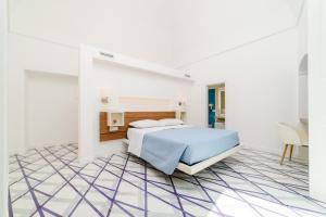 Postel nebo postele na pokoji v ubytování Palazzo Colavolpe Suite + 37 fotografií