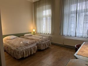 Postel nebo postele na pokoji v ubytování Centrum Hostel