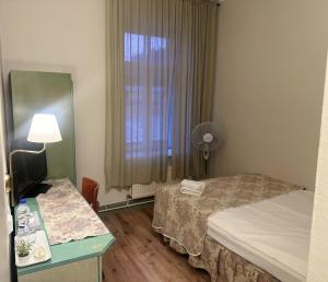 Postel nebo postele na pokoji v ubytování Centrum Hostel