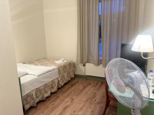 Postel nebo postele na pokoji v ubytování Centrum Hostel