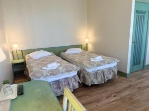 Postel nebo postele na pokoji v ubytování Centrum Hostel