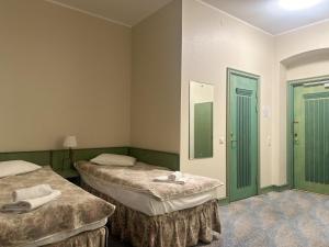 Postel nebo postele na pokoji v ubytování Centrum Hostel