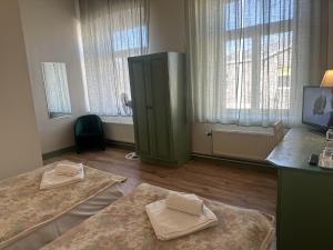 Postel nebo postele na pokoji v ubytování Centrum Hostel
