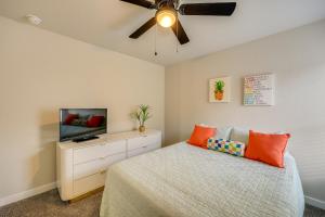 a bedroom with a bed and a ceiling fan at San Antonio Home with Fenced-In Yard Steps to Park! in San Antonio