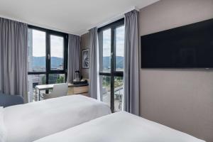 Krevet ili kreveti u jedinici u okviru objekta Radisson Hotel Graz
