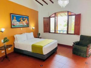 Voodi või voodid majutusasutuse Hotel Pueblito Cafetero toas