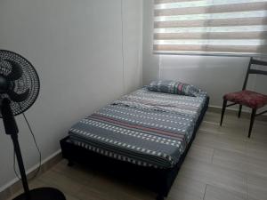 Postel nebo postele na pokoji v ubytování Apartamento en Ricaurte, Arrayanes de Peñaliza