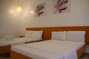 Postel nebo postele na pokoji v ubytování Sea View Resort