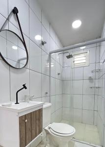 a bathroom with a toilet and a sink and a shower at FlatStudio02 na Nova Betânia - INNOVA in Mossoró