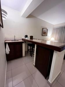 a kitchen with a counter top and a sink at Hotel Boulevard in Lima