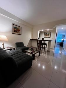 a living room with a couch and a table at Hotel Boulevard in Lima