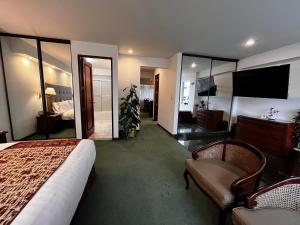 a hotel room with a bed and a large mirror at Hotel Boulevard in Lima