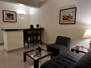 a living room with a couch and a table at Hotel Boulevard in Lima
