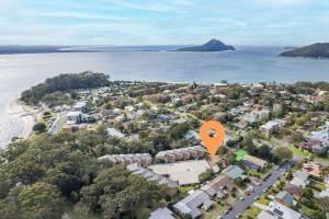 an aerial view of a town with a large orange marker at Bay Parklands 4, 2 Gowrie Avenue - pool & tennis court in Nelson Bay