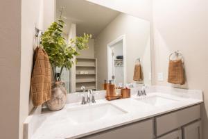 a white bathroom with a sink and a mirror at Mongou Vacation Home in Yukon +51 photos