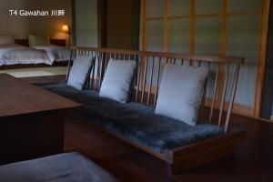 Rúm í herbergi á 滔々 倉敷民藝館南の宿 toutou, Mingeikan Minami no Yado