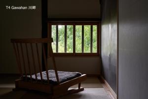 Rúm í herbergi á 滔々 倉敷民藝館南の宿 toutou, Mingeikan Minami no Yado