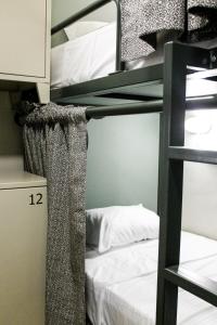 Ένα ή περισσότερα κρεβάτια σε δωμάτιο στο Mascomunal hostel