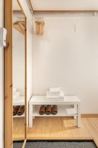 a room with a white table and some shoes at Studio41 in Seoul +29 photos